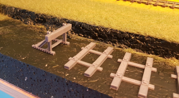 Well, at least first half of the track is laid now, see below. The PLA plastic is a bit shiny so I first hand-painted them flat light gray. Could have done it with the airbrush but I didn´t want paint inside the tie plates. Tricky with getting the r.....